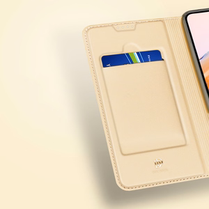 Dux Ducis Skin Pro -suojakuori Xiaomi Redmi 11A / Poco C55 / Redmi 12C:lle läppäkorttijalustalla kultainen